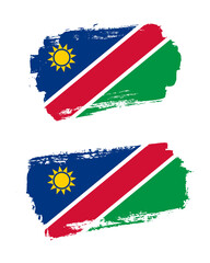Set of two creative brush painted flags of Namibia country with solid background