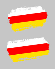 Obraz premium Set of two creative brush painted flags of South Ossetia country with solid background