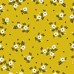 Simple vintage pattern. Small white flowers, dark blue leaves. mustard background. Fashionable print for textiles and wallpaper.
