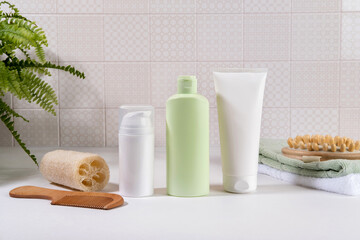 Natural cosmetics, skin care product on table in bathroom. Blank cosmetic skincare makeup containers.