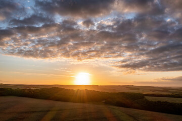 Fototapeta na wymiar Gorgeous aerial drone landscape image of South Downs NP at sunrise in Summer