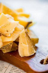 Parmesan, Goat Cheese, Brie, Camembert. Assorted cheeses on the board. Italian cheeses. Snack for wine. Cheese advertisement. Cheeseboard. Delicious cheese