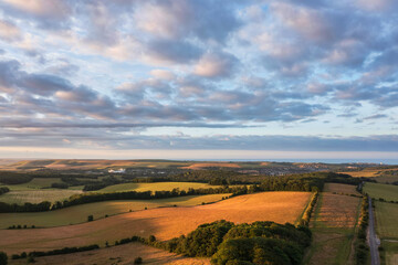 Fototapeta na wymiar Gorgeous aerial drone landscape image of South Downs NP at sunrise in Summer