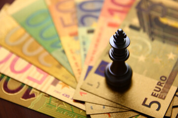 silver king chess on euro banknote , strategy money concept