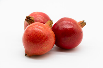 whole pomegranate isolated on white background.