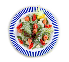 Caesar salad with lightly salted salmon, Romano salad, with blue cheese sauce. On a white background, isolated.