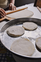 Close up of female hands preparation of dough for Baklava, homemade Baklava with walnuts, old style traditional Turkish recipe, Food pastry