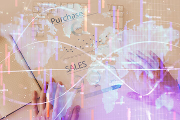 Double exposure of hands and notepad with business icons.