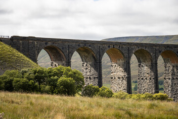 Fototapeta na wymiar Old viaduct in the hills