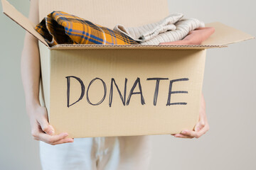 Recycling, Donation for poor, asian young woman pack, hand in holding donate box full with second...