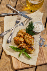 Chicken kebab with a glass of beer