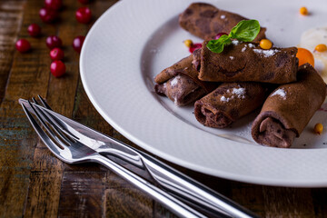 Chocolate pancakes with homemade cottage cheese