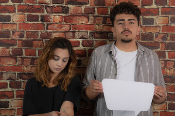 Young man and addicted girl. Young boy holding white idea board