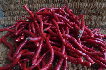 Red Chili is a fruit and plant member of the genus Capsicum