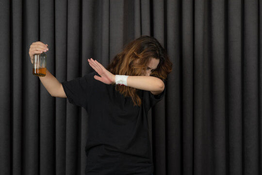 Young Girl Saying No To The Alcohol And Stand On Black Background.