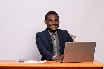 black businessman smiling while working