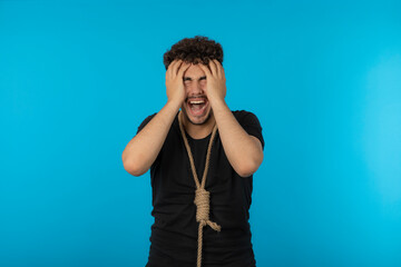 Young man crying and thinking suicide