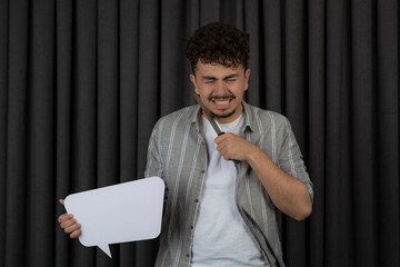 Portrait of depressed guy holding idea board and put knife to his neck
