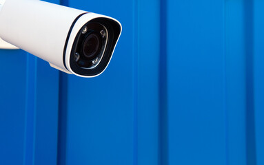 CCTV surveillance camera in factory area to control security system area with torch light and copy space