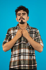 Vertical portrait of man with pop-art makeup