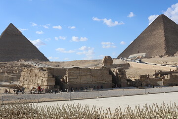 Pyramids of Giza. Scene with tourists near pyramid in Egyptian desert. Travel to the African...