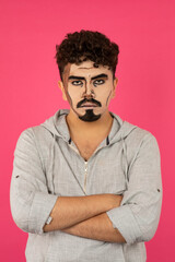 Fototapeta premium A man with pop-up makeup stands on red background
