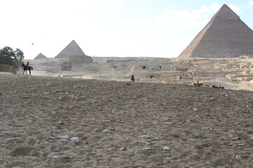 Pyramids of Giza. Scene with tourists near pyramid in Egyptian desert. Travel to the African...