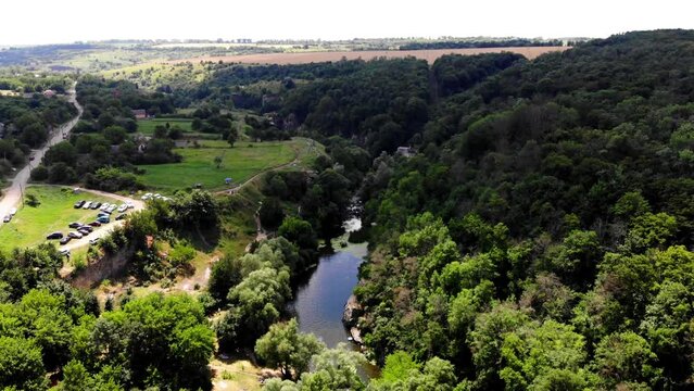 Drone shot Butsky Canyon Ukraine. Aerial view of a rocky canyon on the Gorny Tikich River near the village of Buki. River Gorny Tikich in Proterozoic granites. Ancient deep and narrow canyon 