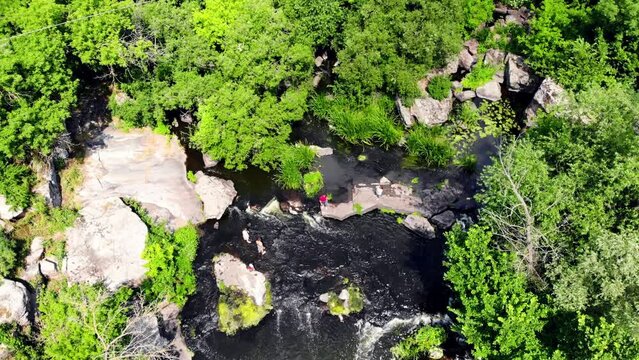 Drone shot Butsky Canyon Ukraine. Aerial view of a rocky canyon on the Gorny Tikich River near the village of Buki. River Gorny Tikich in Proterozoic granites. Ancient deep and narrow canyon 