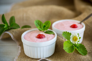 sweet curd mass whipped with fresh strawberries in a bowl