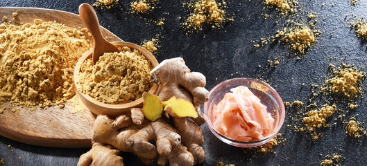 Bowls with marinated and ground ginger and its fresh rhizome