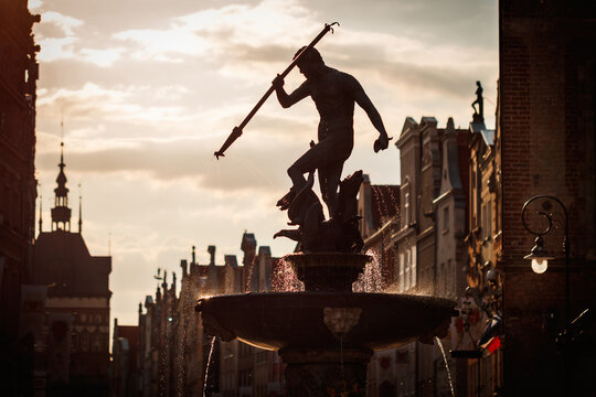 Silhouette Of Statue Neptune Fountain In Gdansk, Poland. Famous Place And Tourist Attraction In Travel Destination 