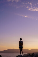 Fototapeta na wymiar girl silhouette on beautiful landspace