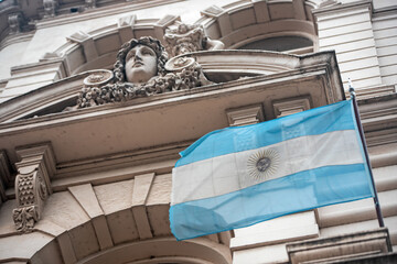 facade of the building with the flag of Argentina