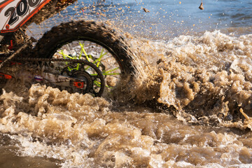 motorcycle wheel in turbulence dirty water