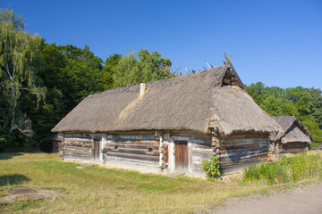 Fototapeta na wymiar Traditional ukrainian house in the museum of national architecture in Pirogovo in a summer day in Kyiv, Ukraine 