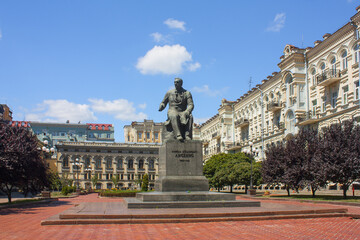 Fototapeta na wymiar Monument to the composer Lysenko near Opera and Ballet Theater on Vladimirskaya Street in Kyiv, Ukraine