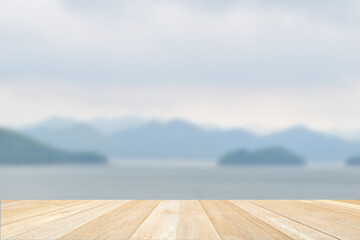 Empty top wooden table on nature view of lake blurred background