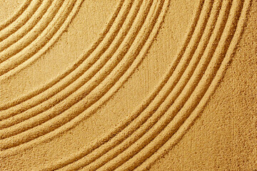 Fototapeta na wymiar Texture yellow sand summer day and smooth lines