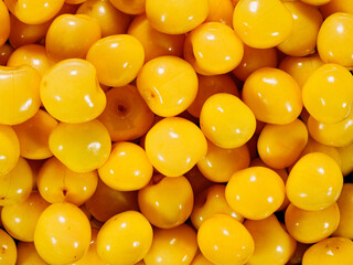 Lots of detail yellow cherry berries as a background