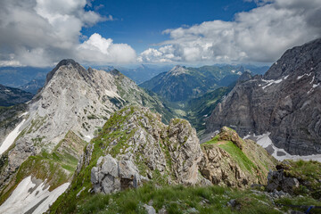 Fototapeta na wymiar Between Italy and Austria: on the top of mountain near Volaia Lake Raunchkofer Mountain (Lago di Volaia Monte). Mountain hiking Trail Road.