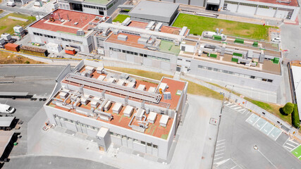 Aerial view on the roof of a factory. The pipes are visible.