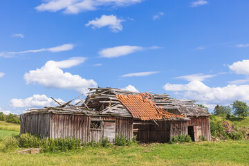 Collapsed wooden barn in the countryside