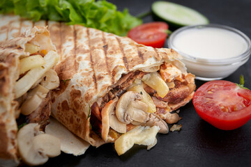 Shawarma with pork, mushrooms, potatoes and sauce