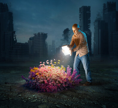 Man reveals flowers with glowing book