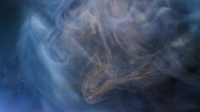 White ink spreading in water on a black background. Colored acrylic cloud abstract smoke background. Glitter fluid motion. 