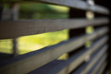 Wooden veranda. Fence in house. Details of architecture in countryside.