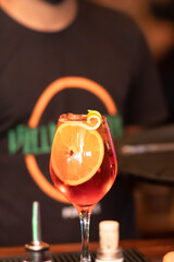 Special drink served with orange at the bar