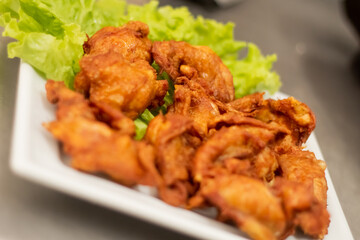 Chicken and bird with lettuce being served in Brazilian Pub bar