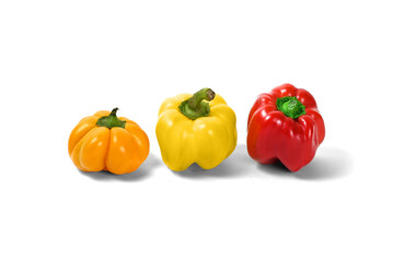 red and yellow peppers white background
